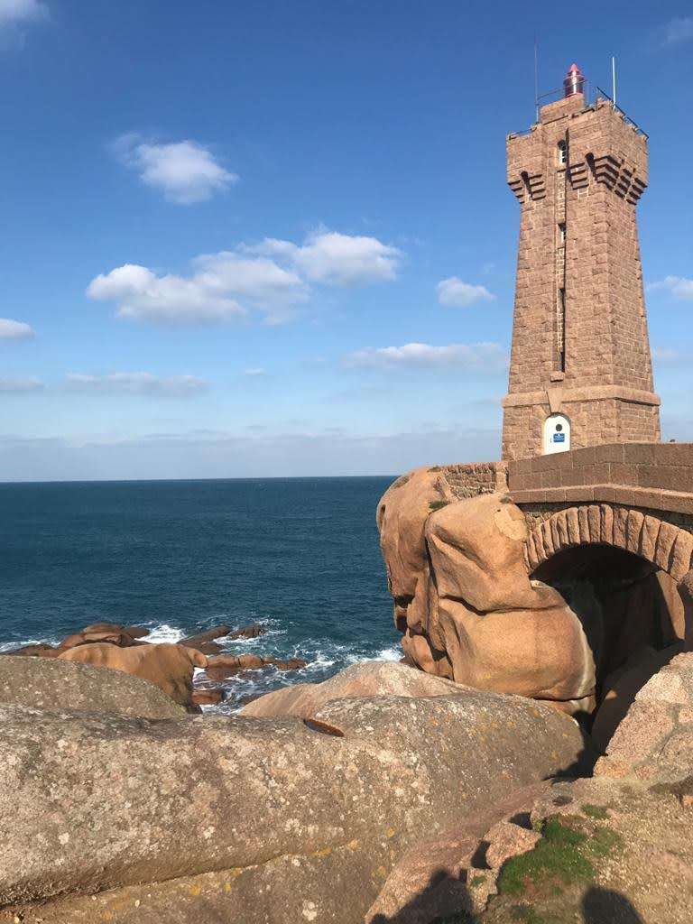 lighthouse along the pink granite coast