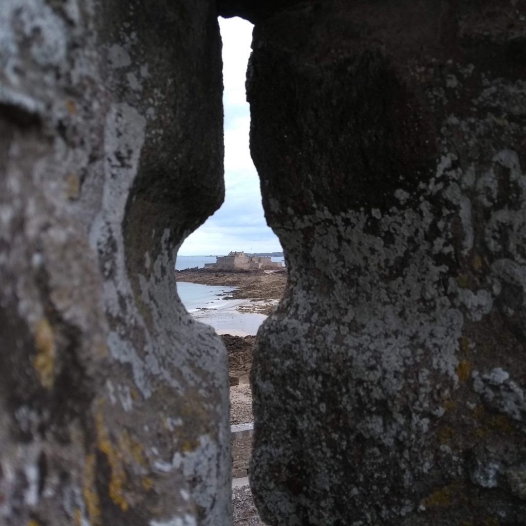 peering through the walls of the ramparts in saint-malo, brittany