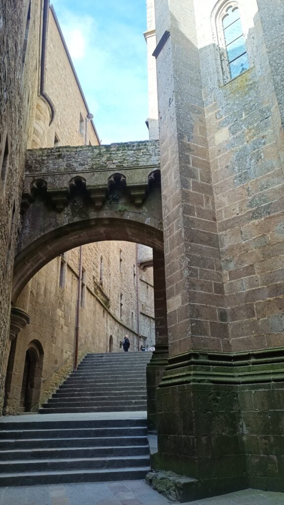 abbey-msm walking up the steps of the abbey inside the mont-saint-michel